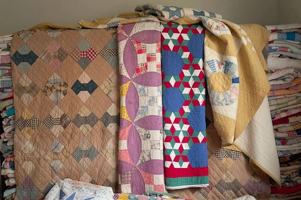 A picture contains a bundle of 11 cutter quilts.