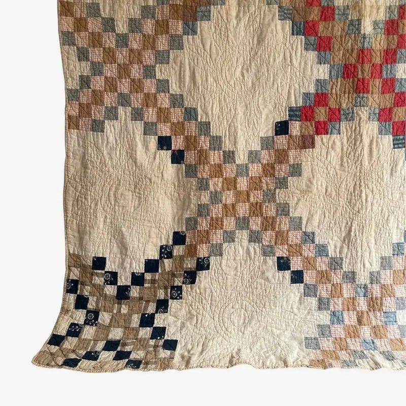 Cutter Triple Irish Chain Quilt in earthy tones with recycled fabric pieces in warm brown, tan, cream, and muted green shades. The worn quilt pattern highlights its antique character and is displayed as the featured image for the Cutter Quilts collection.