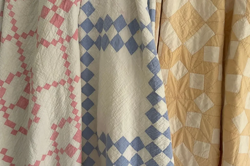 two color quilts in blue/white, pink/white and yellow/white colots